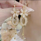 🌼✨ Eleganckie kolczyki z wiszącymi frędzlami w kształcie kwiatów – pasują do każdego stylu – płatność przy odbiorze ✅